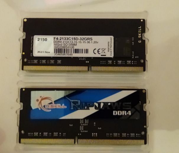 two ram sticks with stickers that cover only half of the surface of the ram stick on each side